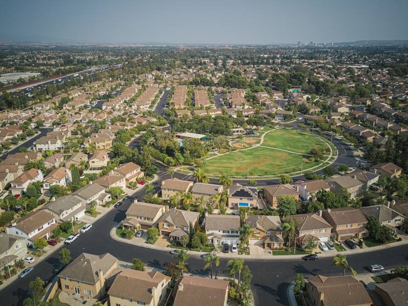 Aerial view of a suburban tract neighborhood around a park